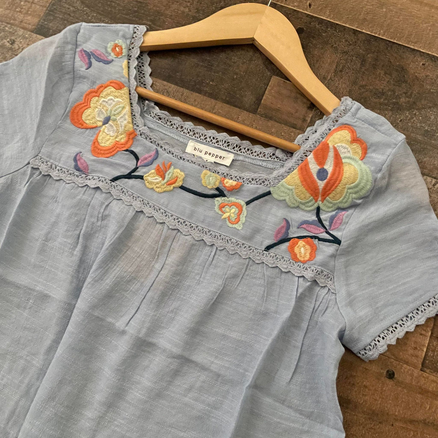 Whimsical Blooms: Flowy Short Sleeve Top with Embroidered Flowers