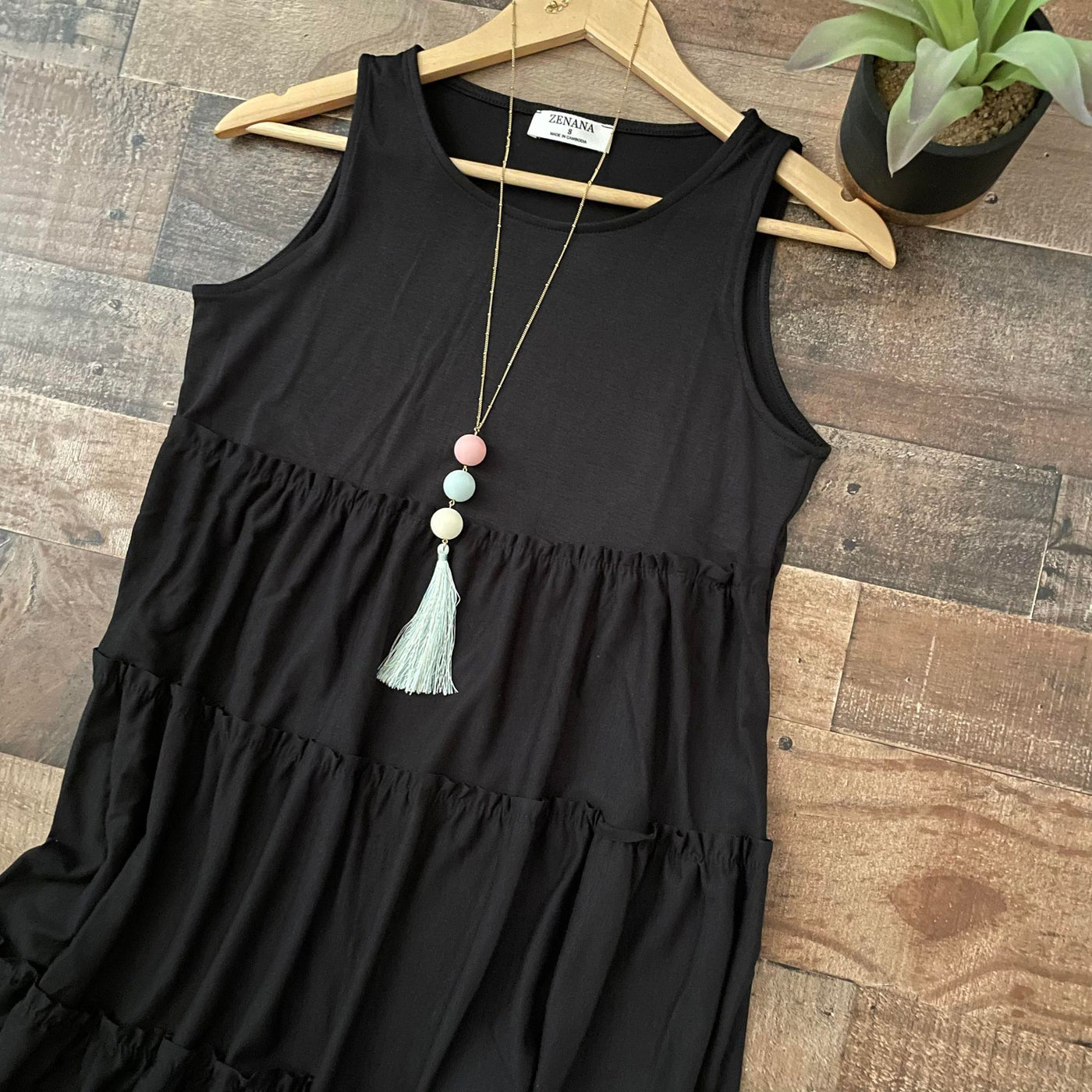 Charmingly Cute: Sleeveless Tiered Black Dress for Effortless Style